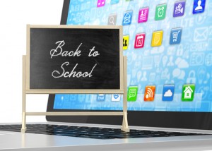 Back To school technology, a chalkboard sign with a computer