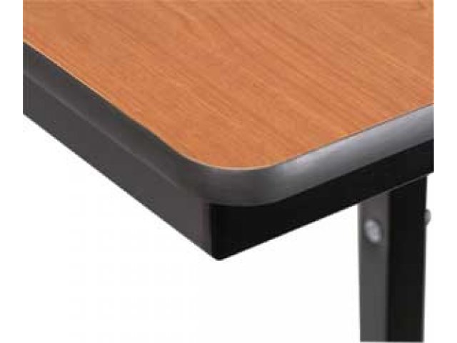 Apron under tabletop hits an angle at each edge; more support than rounded aprons on other tables.