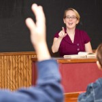 Teacher calling on student raising hand, classroom fun